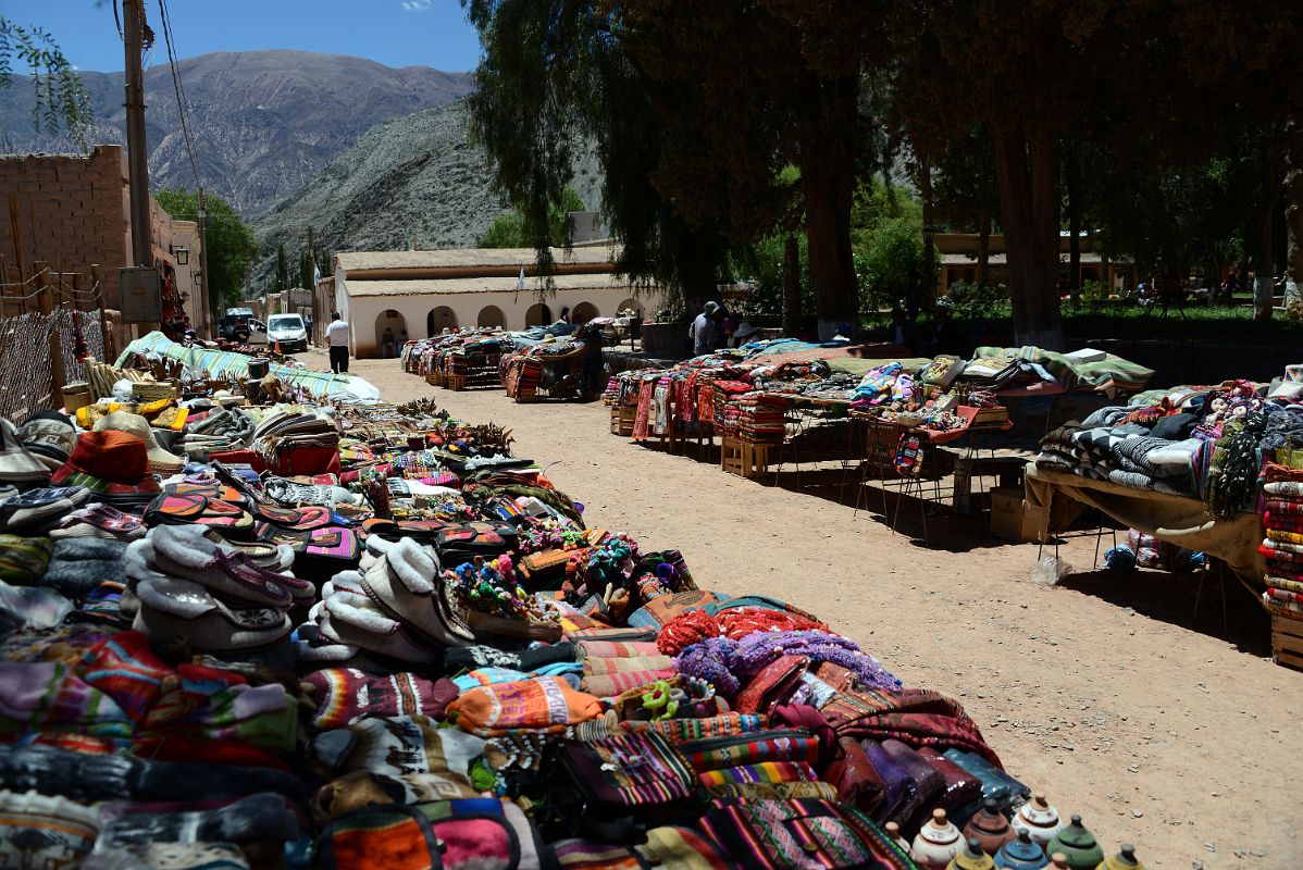03 Bolivian-style Woven Blankets, Alpaca Wool Clothing, Hats, Scarfs For Sale In The Main Square Plaza 9 de Julio in Purmamarca